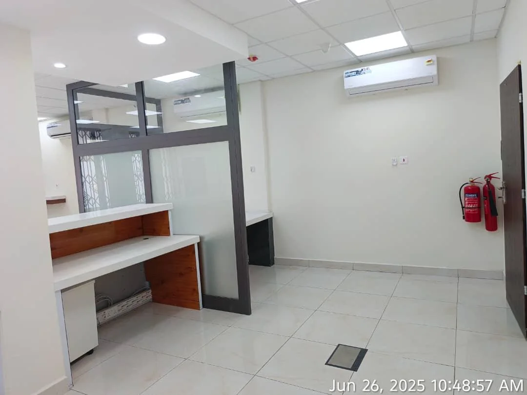 Private office with a glass partition and warm timber detailing