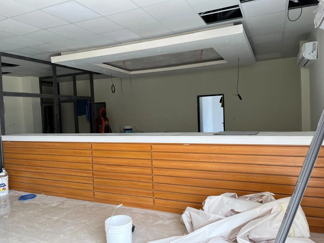 Custom timber joinery forming the library issue counter